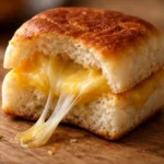 mini grilled cheese sandwiches on hawaiian rolls with melted cheese