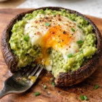 avocado and egg stuffed portobello mushrooms on a plate delicious healthy breakfast recipe