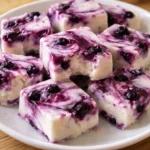 blueberry swirl yogurt bites healthy snack idea with fresh blueberries and creamy yogurt swirl on a plate