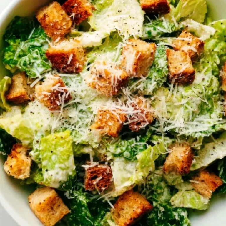 Fresh and delicious Caesar salad topped with croutons and parmesan cheese.