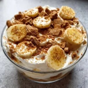 Creamy Biscoff banana pudding in a dish decorated with Biscoff cookies