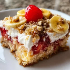 Delicious banana split dump cake topped with whipped cream and cherries