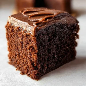 Delicious small chocolate cake with rich frosting and decorative sprinkles